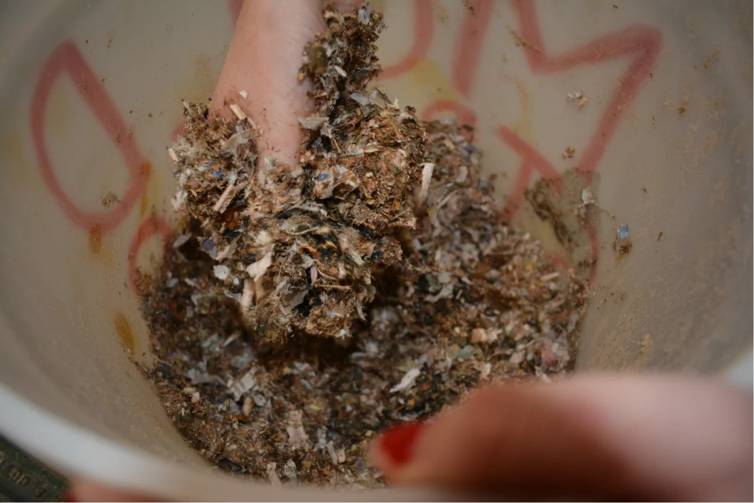 Mixing the wet composite by hand in a bucket