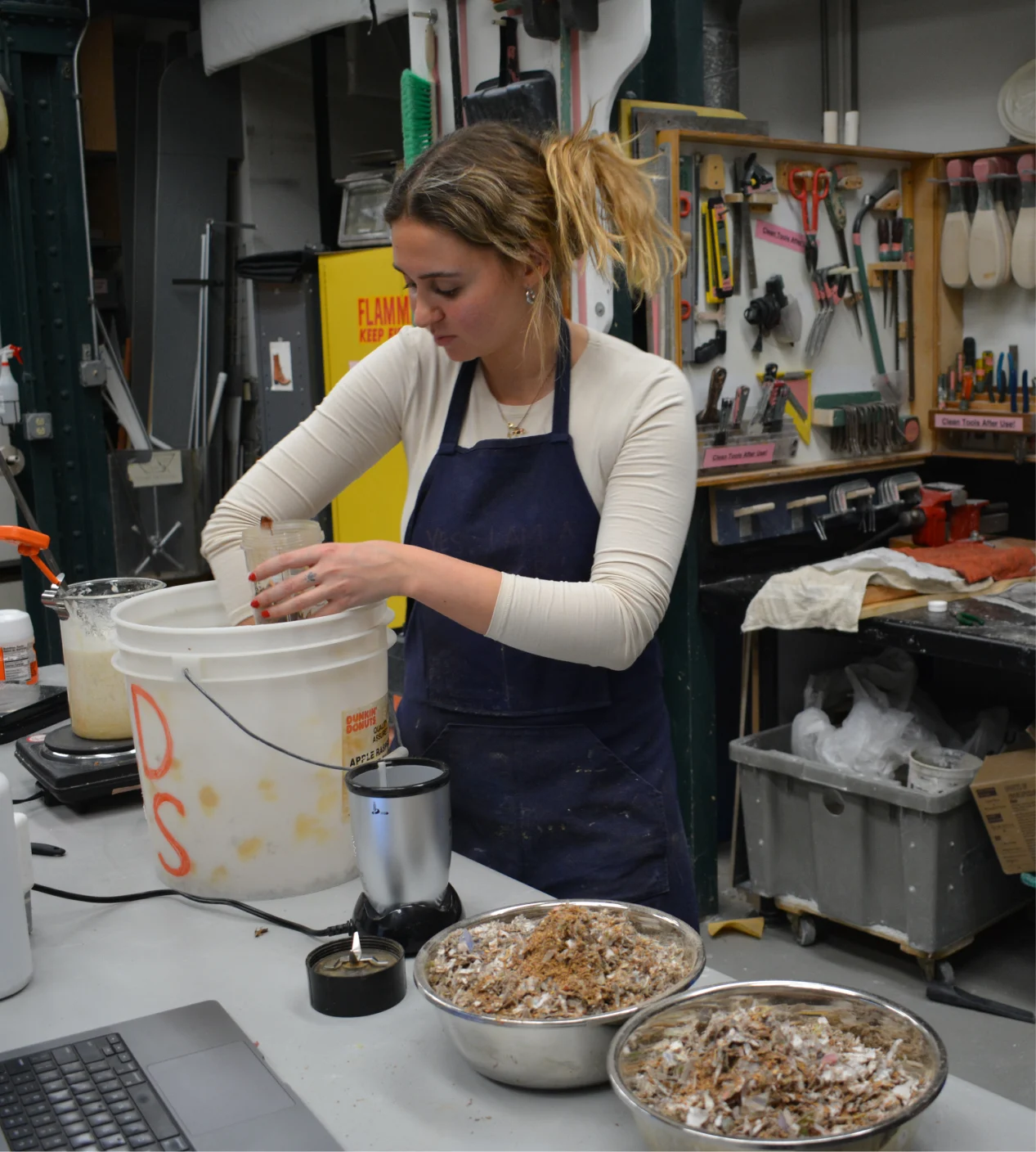 Blending ingredients at the workshop bench