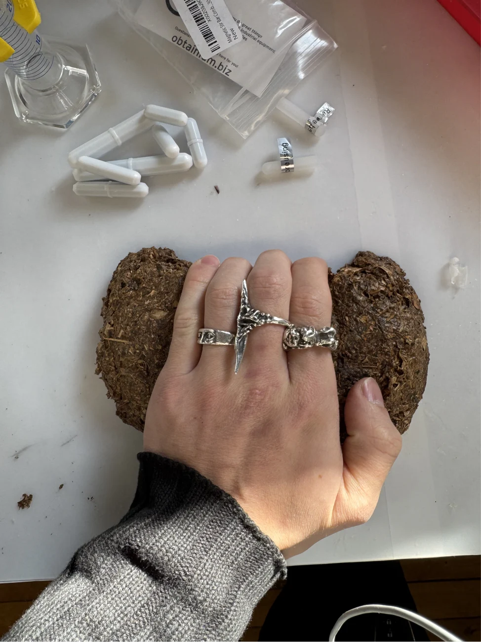 A hand gripping a composite hold