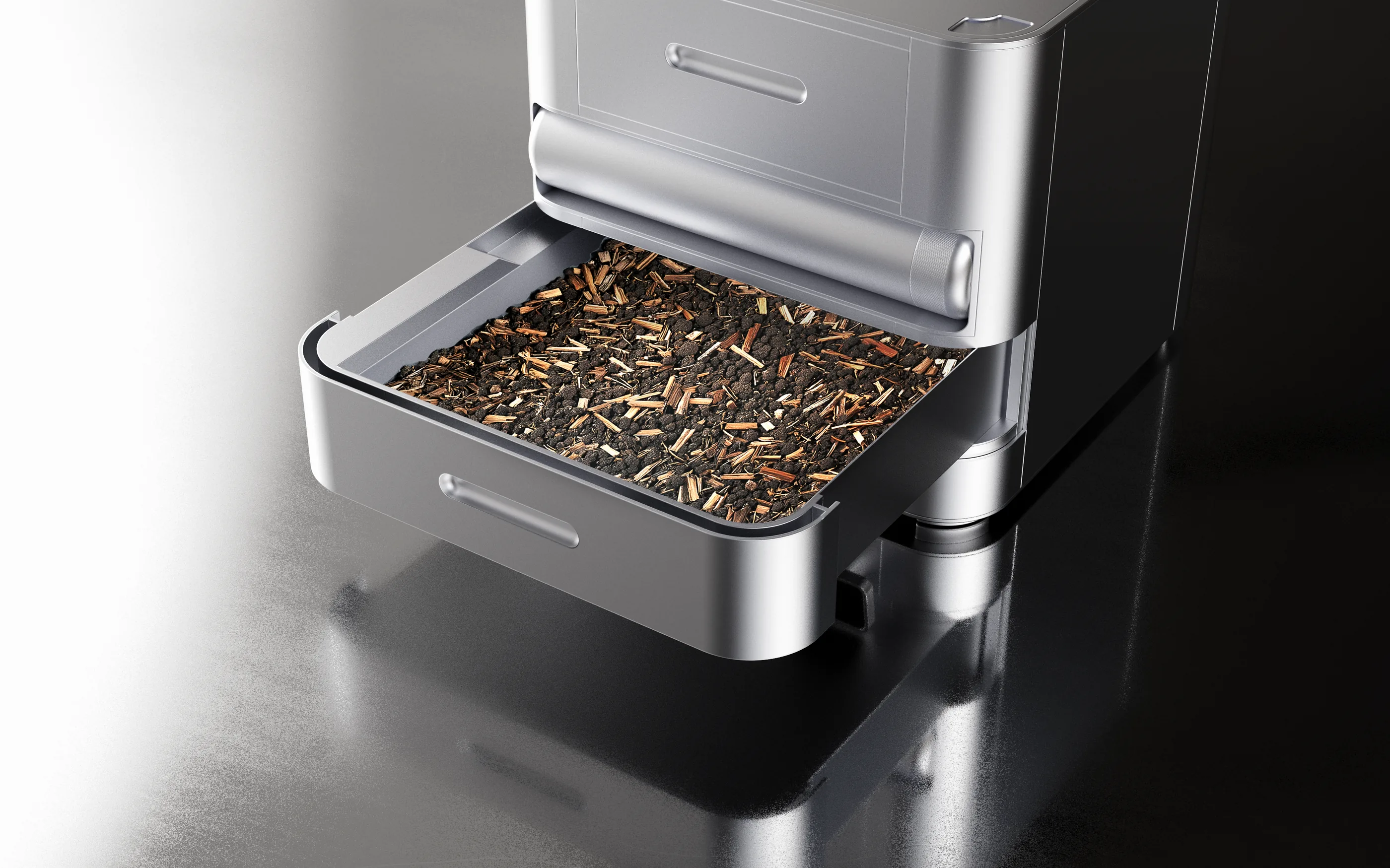 The feeding tray pulled out, filled with soil and feed